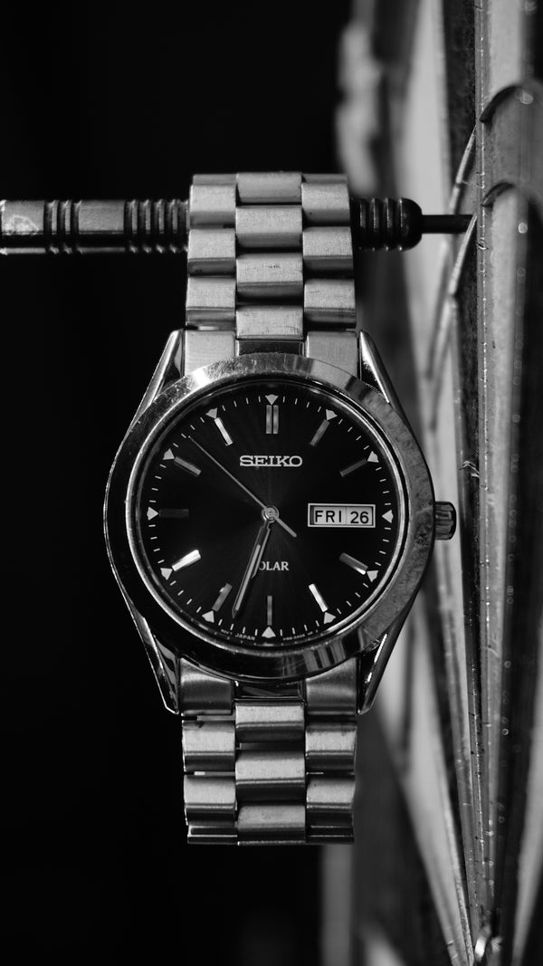 Seiko solar watch on a dartboard.